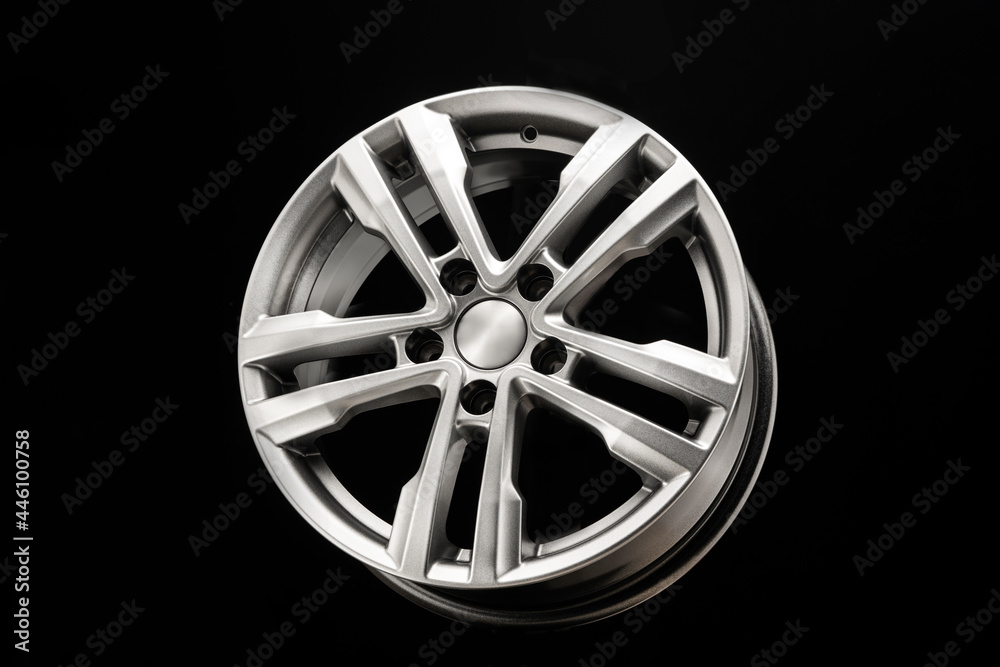 Fototapeta premium grey silver alloy wheel on black background