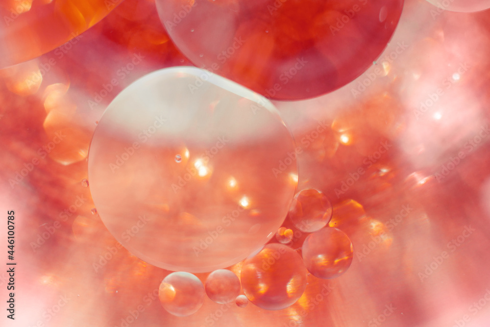 Oil bubbles close up. circles of water macro. abstract orange and fiery red background