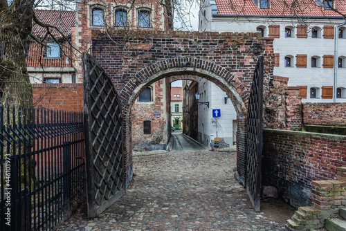 Gateway on Podmurna Street in historic part of Torun city, Poland photo