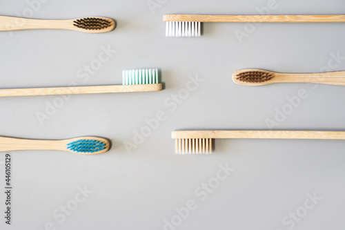 Ecology toothbrush on grey background. Different color. Diversity concept. Sustainable mouth product. Zero waste lifestyle. Organic accessory group. Dental health at home. Biodegradable recycle