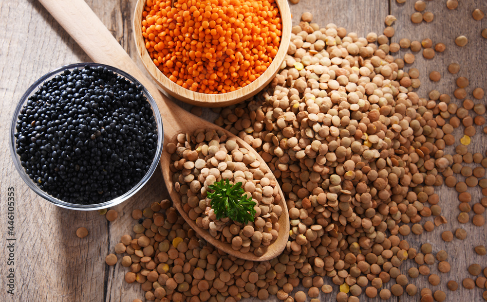 Composition with three sorts of lentils on wooden table Composition with three sorts of lentils on wooden table
