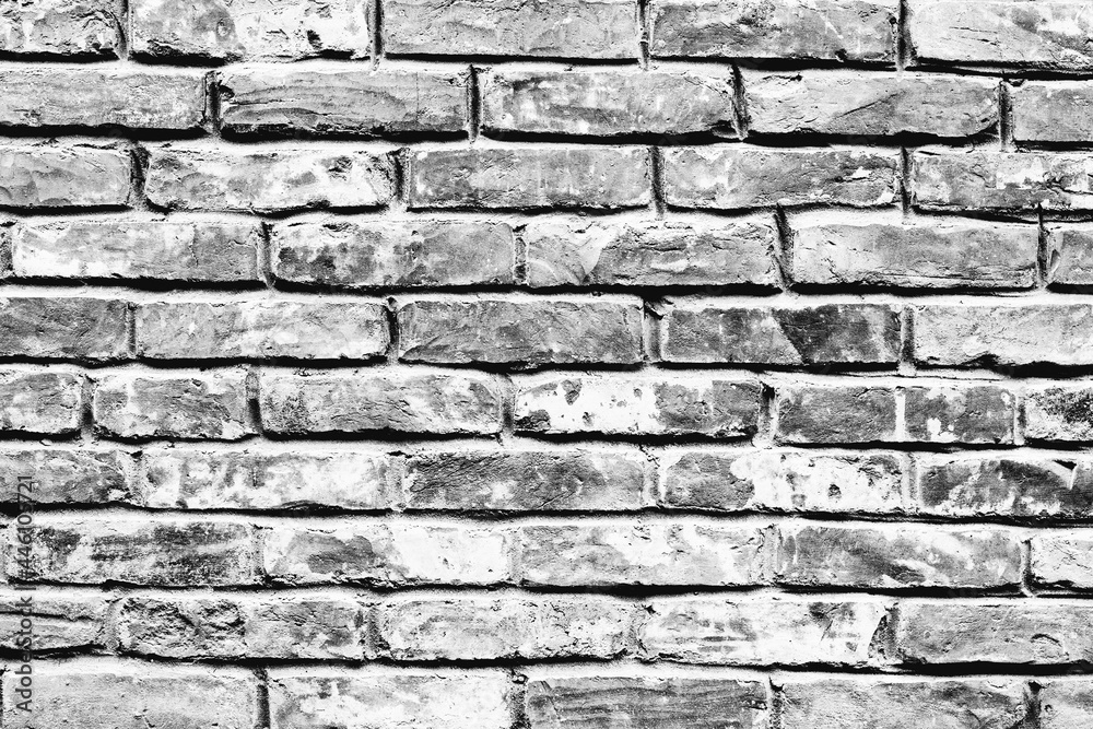 Obraz premium Texture of a brick wall with cracks and scratches which can be used as a background