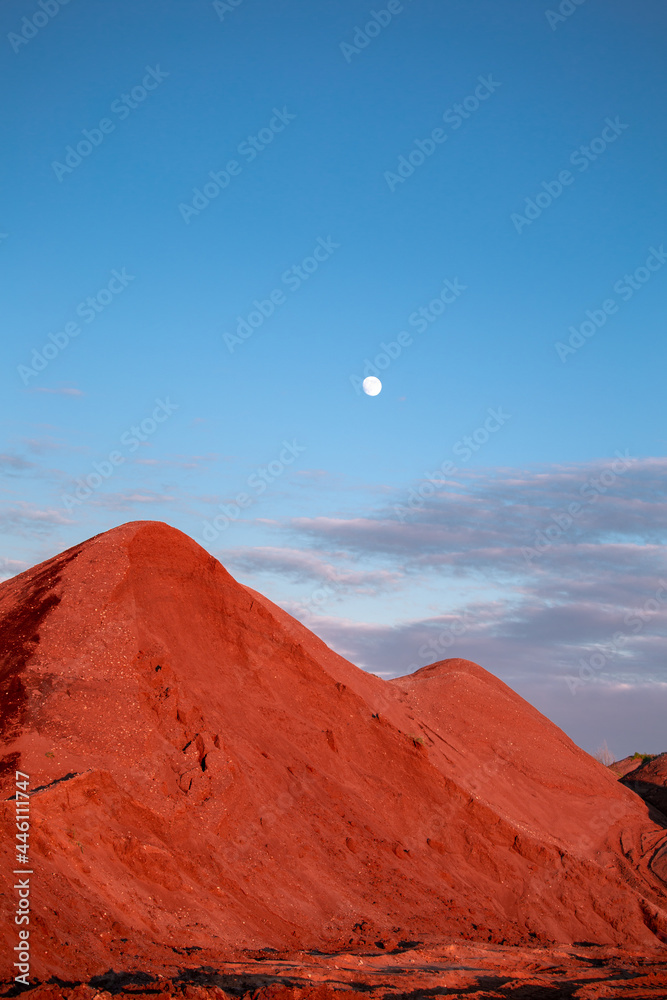 sunset over the sand mountains with moon 