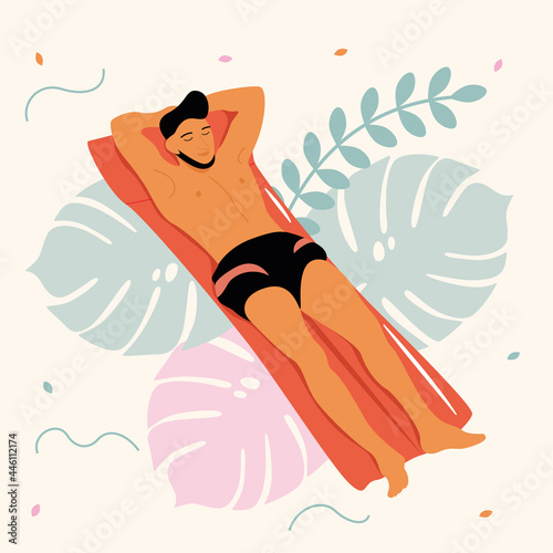Man swims on an inflatable mattress at a beach party