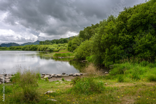 Lovely walk on the bank of Bassenthwaite Lake on a cloudy summer afternoon, Lake district, England
