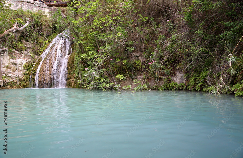 Obraz premium waterfall in the forest, Oasis in the mountains in Cyprus, called Adonis Bath 