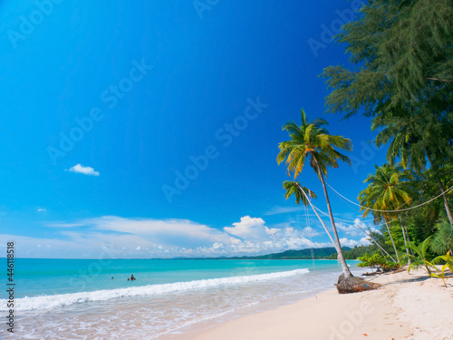 Quiet tropical beach on a sunny day (Coconut beach, Khao Lak, Phang Nga, Thailand) photo