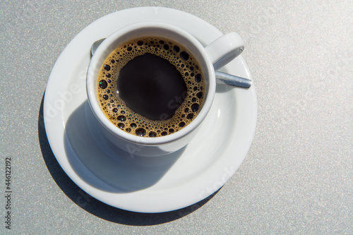 Fototapeta Naklejka Na Ścianę i Meble -  White cup of black coffie on gray background