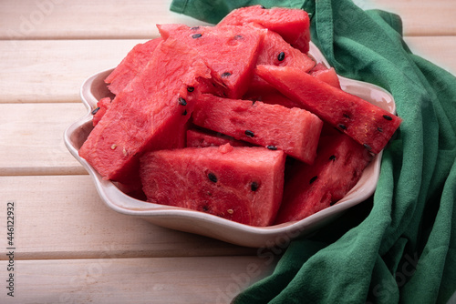 Slices of juicy sweet watermelon on a plate with a green napkin.