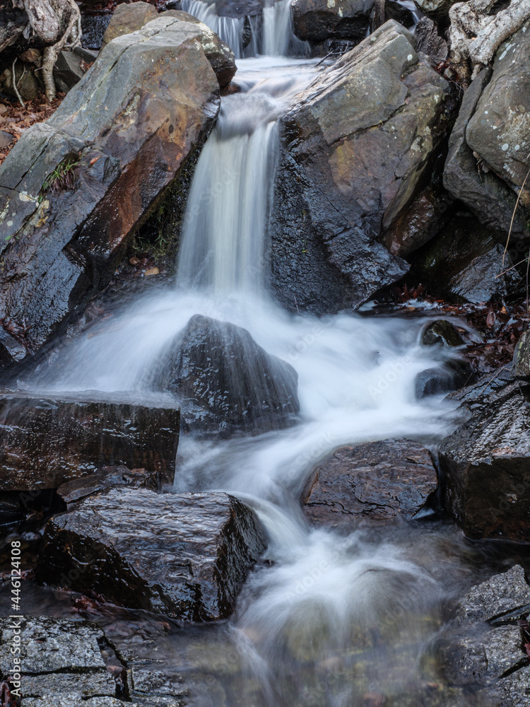 Small waterfall with blurred water movement. Small waterfall with blurred water movement.