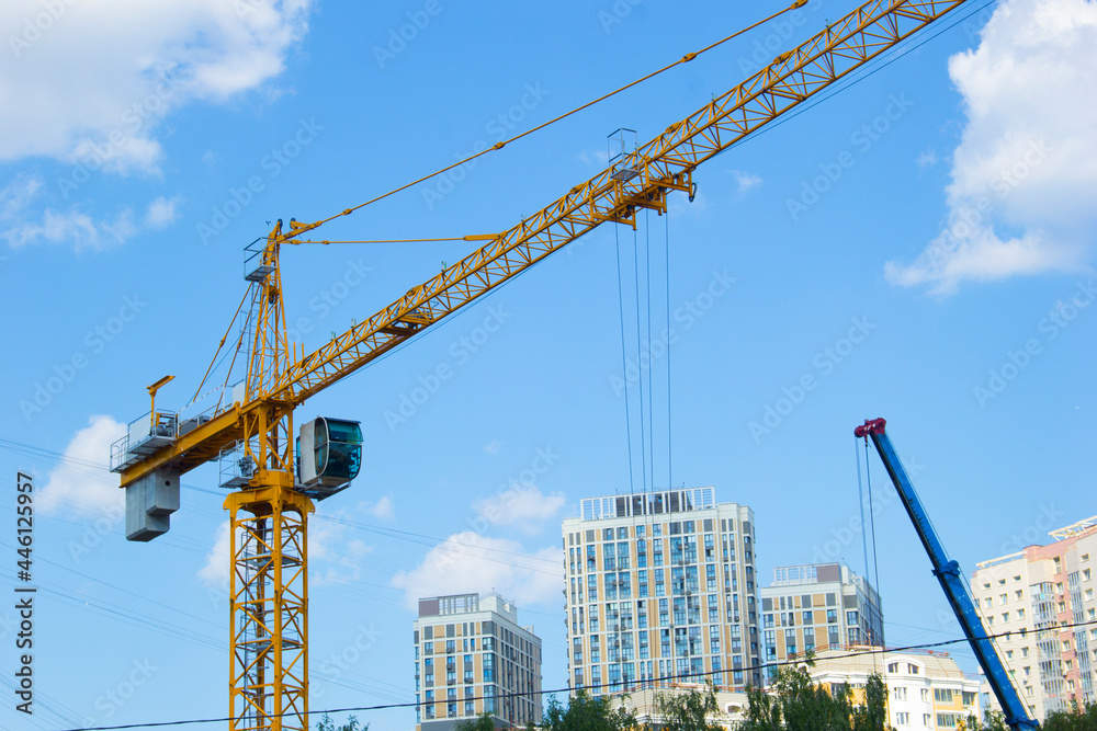 Lifting crane. Crane work on the construction site