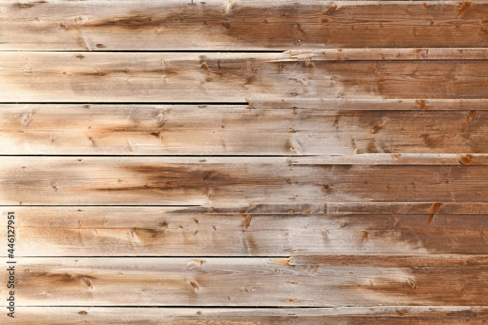 Fototapeta premium Horizontal weathered wood background with brown colored planks with fading colors