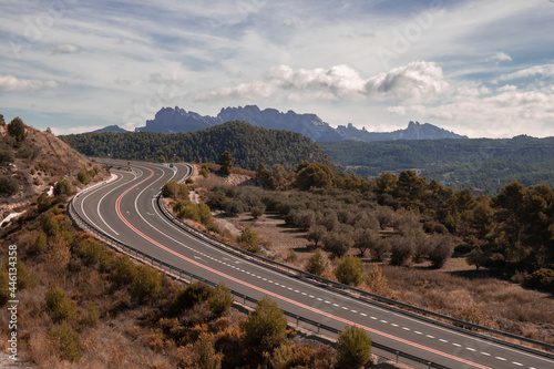 Curved road and Montserrat mountain