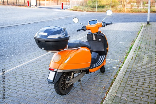 Obraz na płótnie Colorful orange scoot for rent, transport w salonie
