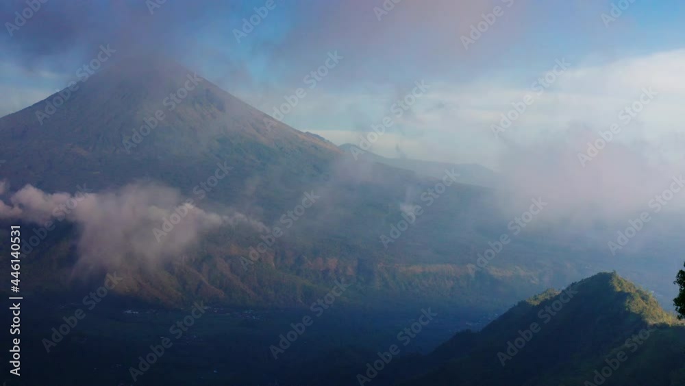 Aerial video in time lapse mode of the volcano Agung in Bali Indonesia with clouds moving fast