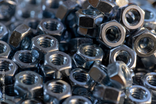 Stacked bolt nuts.