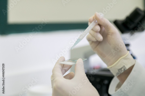 close up of hands holding test tube