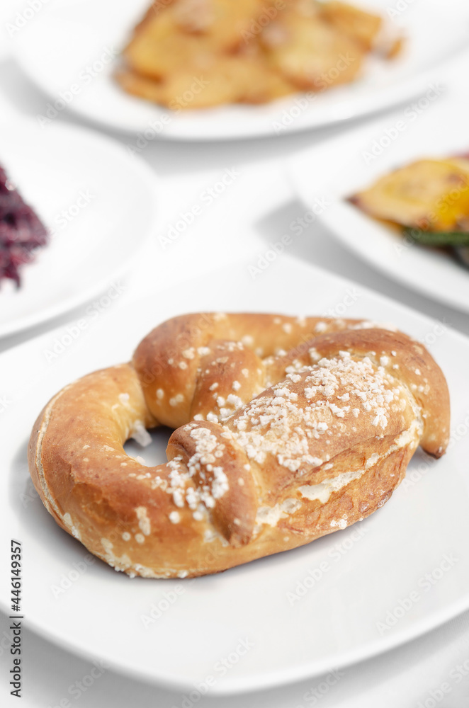 vegan dairy-free organic german pretzel bread on white table