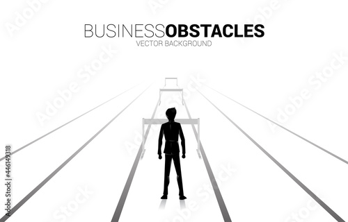 Silhouette businessman standing with hurdles obstacle. Background concept for Obstacle and challenge in business