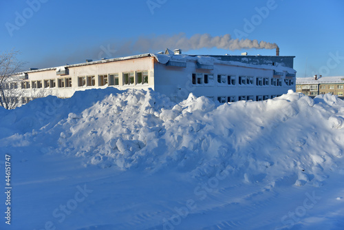 high snowdrifts in winter and an abandoned school building