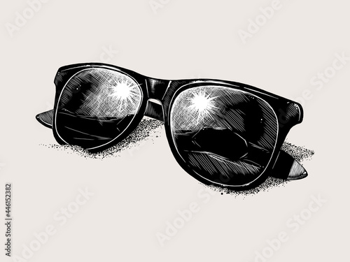 Hand-drawn sketch sunglasses on the sand isolated on beige background. Vintage style. Vector illustration for posters and print