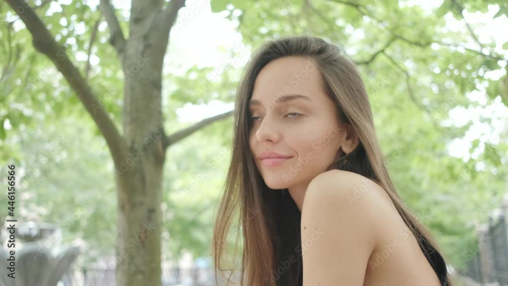 beautiful brunette posing and smiling in the park beautiful brunette posing and smiling in the park