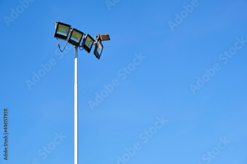 Lighting equipment of a sports field, off, during the day.