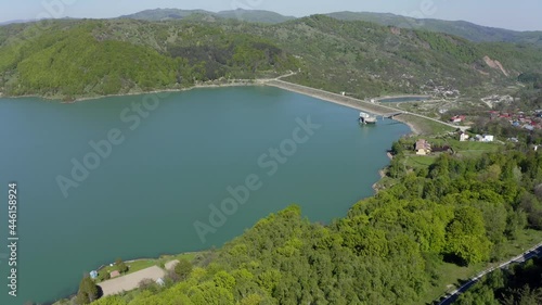 AERIAL - Maneciu dam, hills and forest in Romania, descending wide shot photo