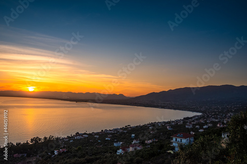 Aerial view of Kalamata city, Greece at sunset. Kalamata is one of the most beautiful cities in Greece and a popular tourist destination © panosk18