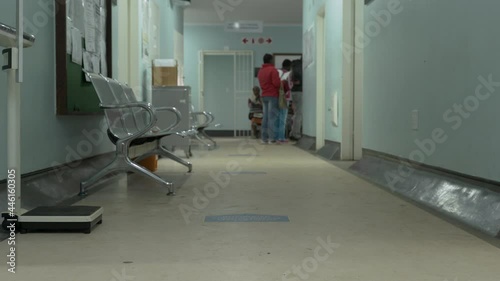 Tilt-up to patients waiting to see a doctor, at waiting area, in a government hospital in Johannesburg, South Africa. photo