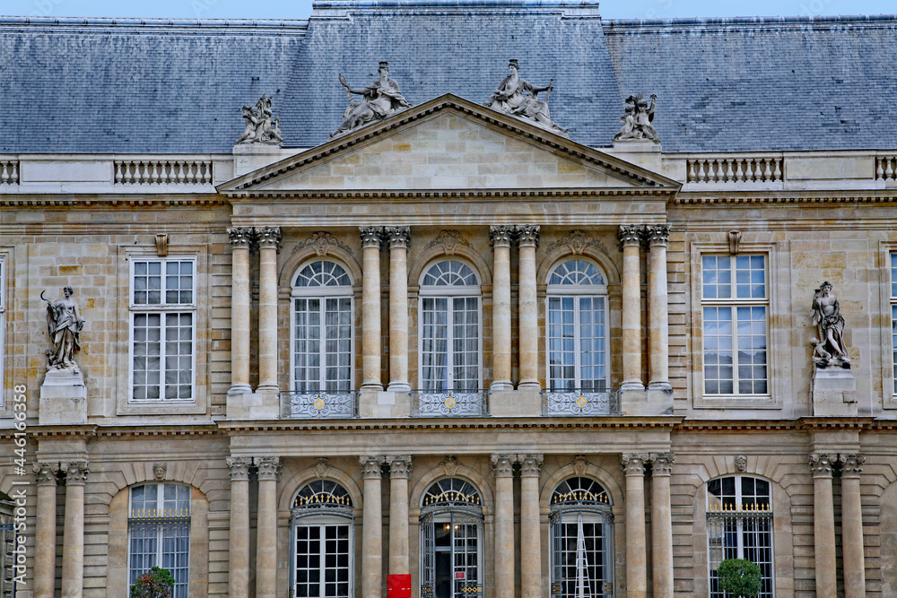 Paris, France :  The ornate baroque facade of the French National Archives museum in the Marais district, housed in the 18th century Soubise palace, built on 14th century foundations..