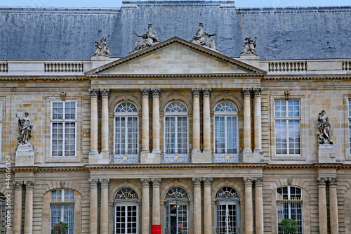Paris, France : The ornate baroque facade of the French National Archives museum in the Marais district, housed in the 18th century Soubise palace, built on 14th century foundations..