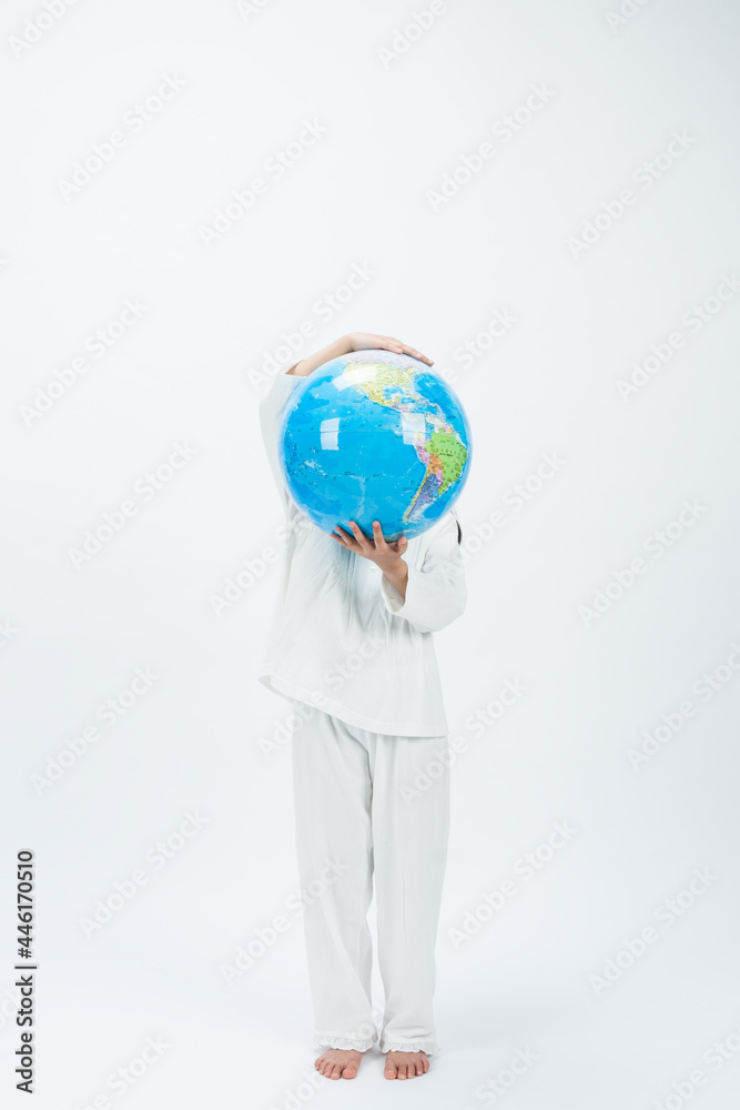 person holding globe person holding globe