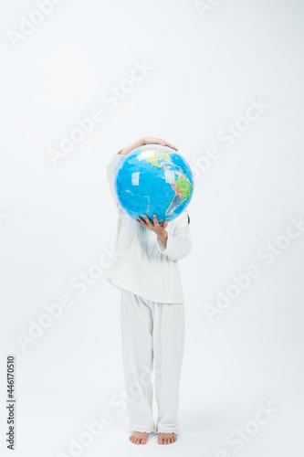 person holding globe