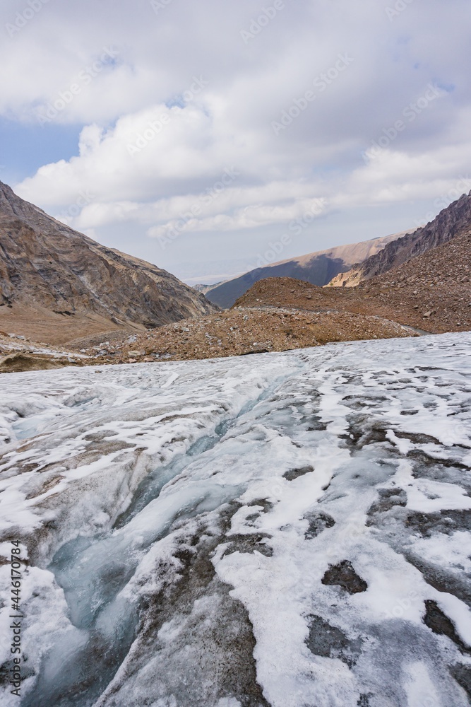 Man doing hiking in the high mountains on the glacier