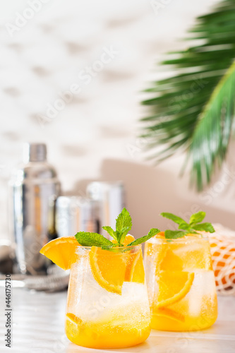 Summer refreshing orange hard seltzer cocktail with shadows