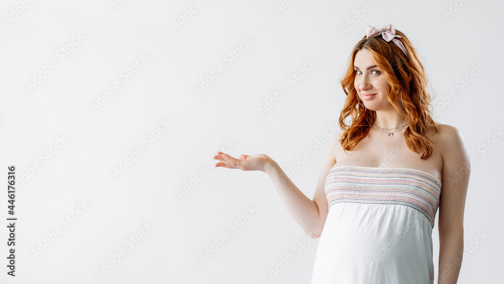 Baby shower party. Pregnant woman. Open palm. Important information. Advertising background. Pretty smiling tummy lady holding promoting hand isolated white copy space.