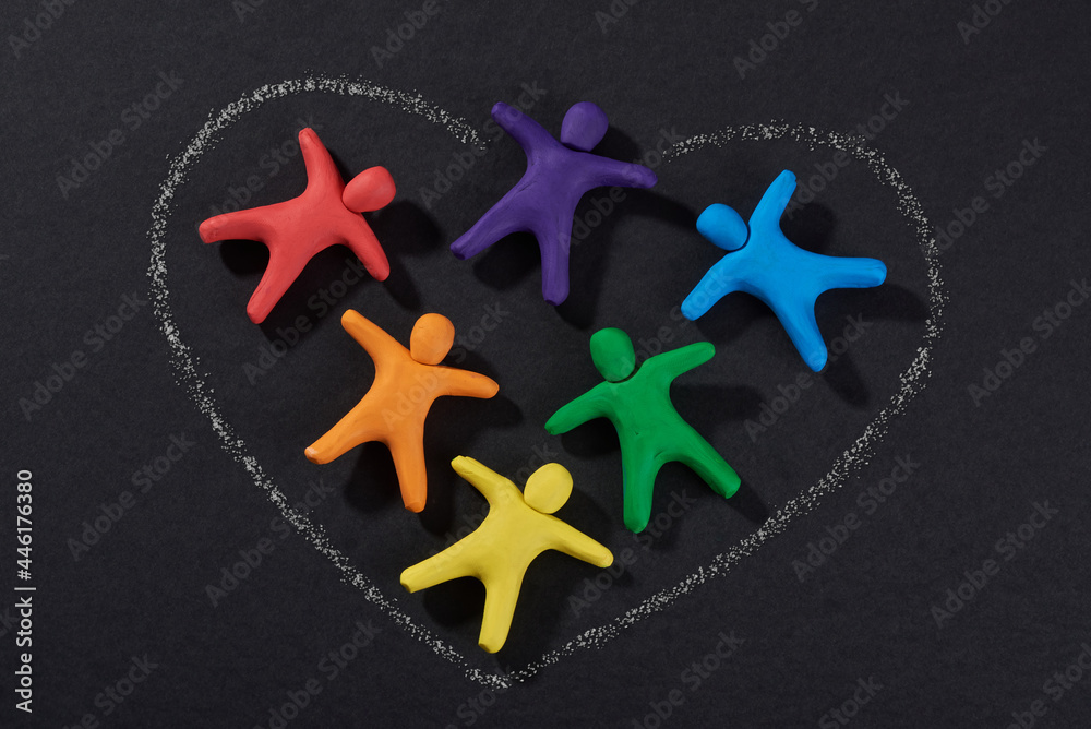Multicultural people together. Justice and no racism concept. Gender and racial equality. DIY. Children's crafts from colored plasticine. Group of people in shape heart. - obrazy, fototapety, plakaty 