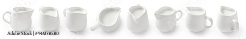 Foto Collection of porcelain milk jars isolated on white background