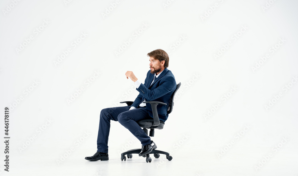 business man in a suit sitting in a chair emotions studio business man in a suit sitting in a chair emotions studio