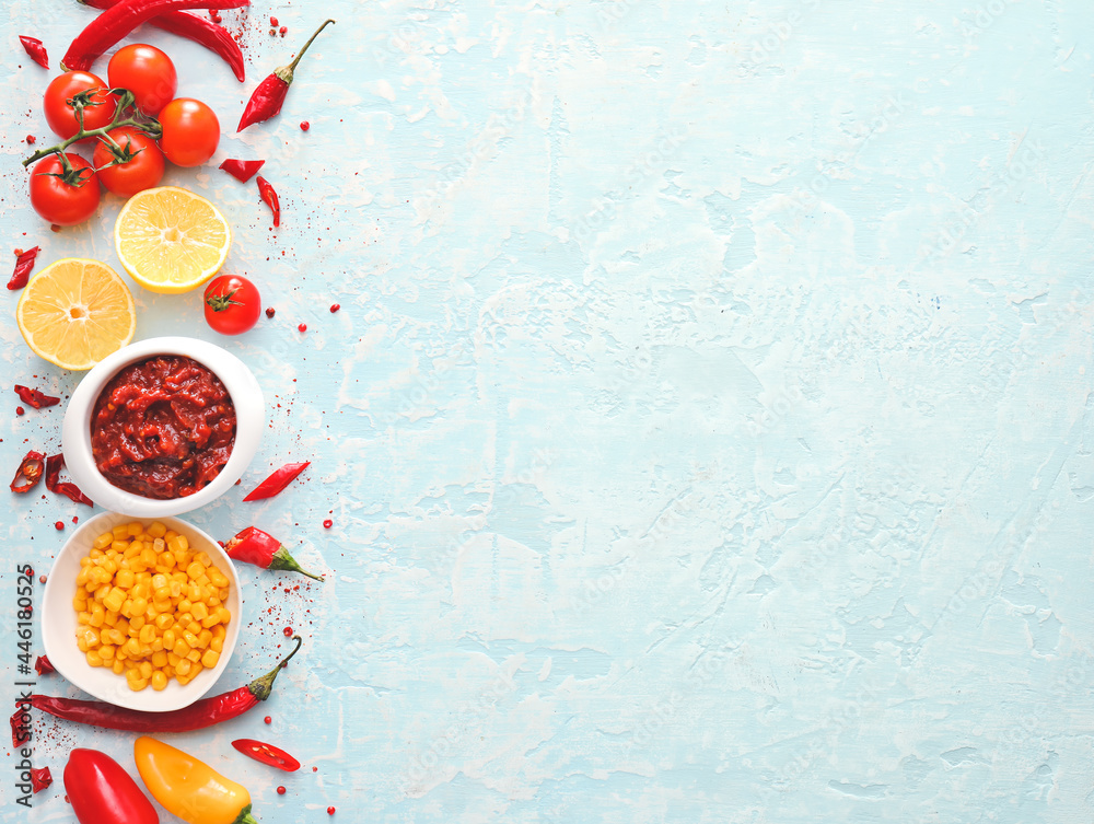 Bowl of tasty salsa sauce and products on color background