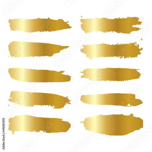 Gold metallic brush stroke set. Isolated hand drawn vector brushes. Gold glitter texture.