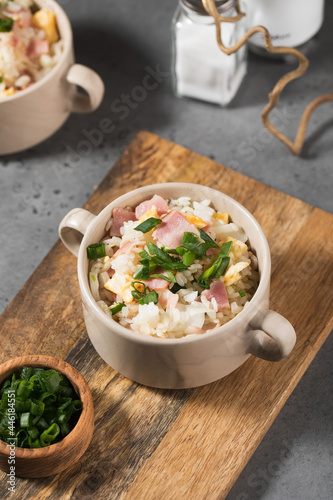 Fried rice with bacon and egg. Asian rice dish. Copy space.