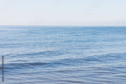 Deep blue and rough sea with lot of sea spray.Blue background.Soft focus blurred image.