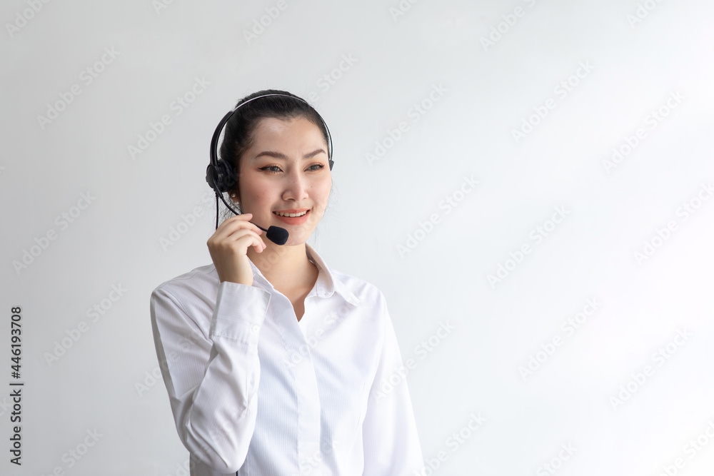 callcenter woman isolated on white background. Portrait Happy Asian woman operator and team working with headsets and desktop computer at telemarketing customer service. callcenter woman isolated on white background. Portrait Happy Asian woman operator and team working with headsets and desktop computer at telemarketing customer service.