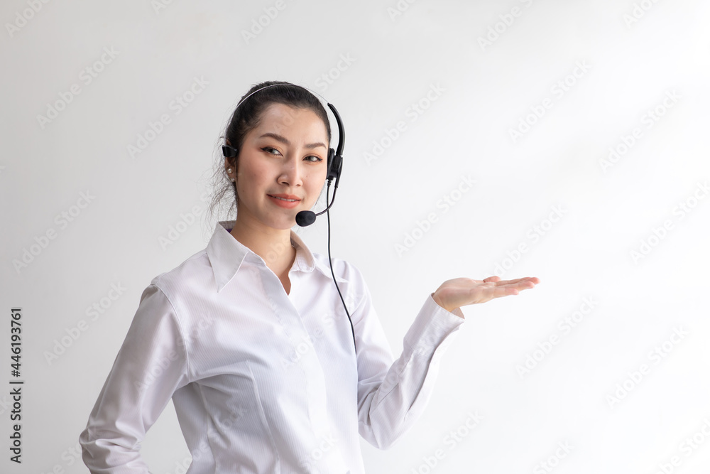 callcenter woman isolated on white background. Portrait Happy Asian woman operator and team working with headsets and desktop computer at telemarketing customer service. callcenter woman isolated on white background. Portrait Happy Asian woman operator and team working with headsets and desktop computer at telemarketing customer service.