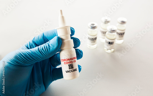 intranasal covid vaccine in the nurse's hand photo