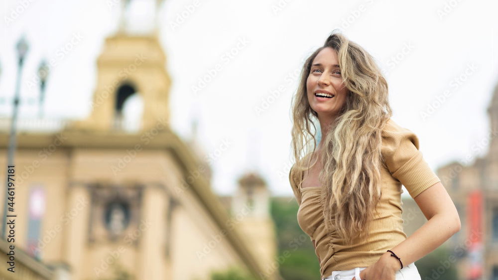 Happy caucasian woman in dress with view of Barcelona