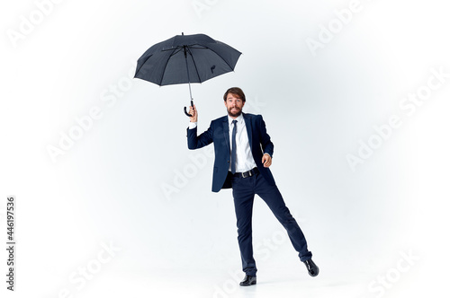 man in suit with umbrella weather protection from rain © SHOTPRIME STUDIO