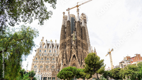 The Sagrada Familia, greenery and construction works in Barcelona